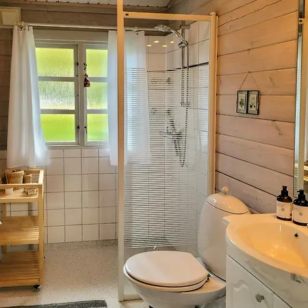 Holiday home Black-painted Log House Overlooking Vejle Fjord *