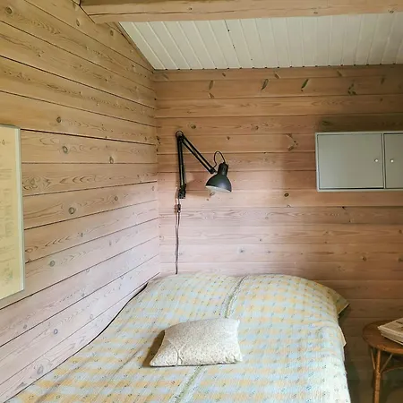 Black-painted Log House Overlooking Vejle Fjord * Børkop