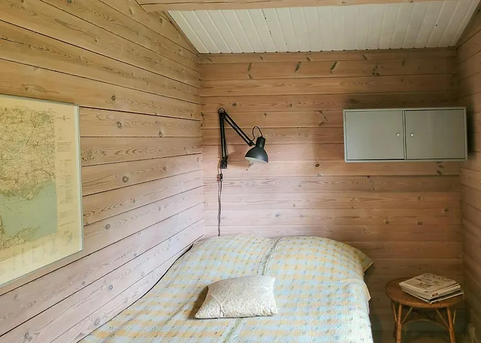 Black-painted Log House Overlooking Vejle Fjord * Børkop