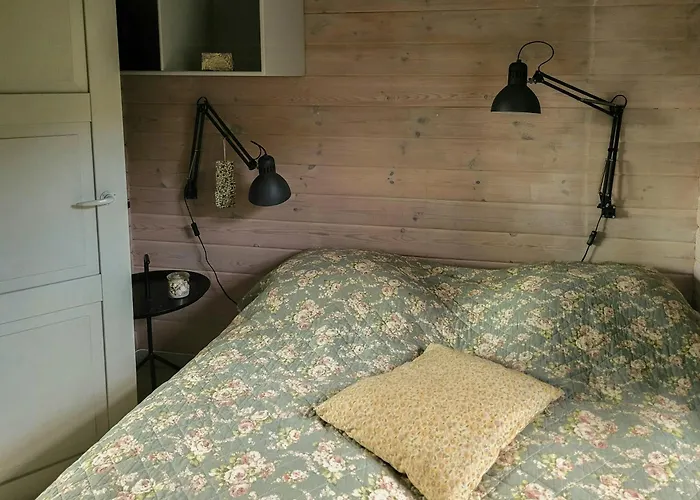 Semesterbostad Black-painted Log House Overlooking Vejle Fjord