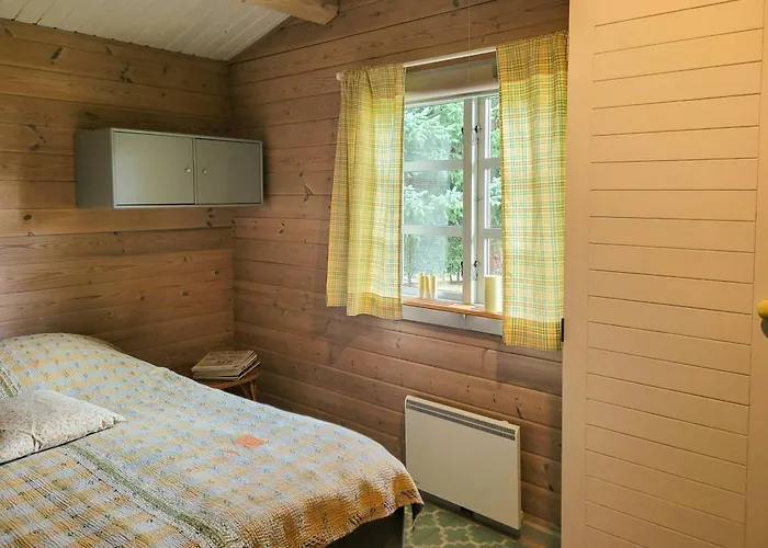 Semesterbostad Black-painted Log House Overlooking Vejle Fjord Børkop