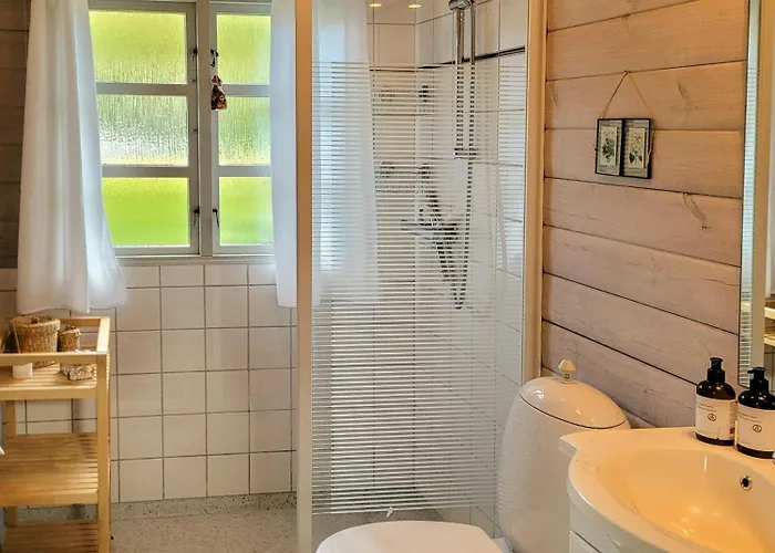 Black-painted Log House Overlooking Vejle Fjord * Børkop